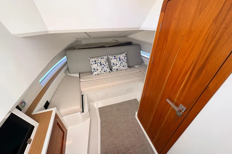 Casa - Ashanty Yacht Photos Pics Interior of 2025 De Antonio Yachts D32, featuring cozy seating and wooden accents.