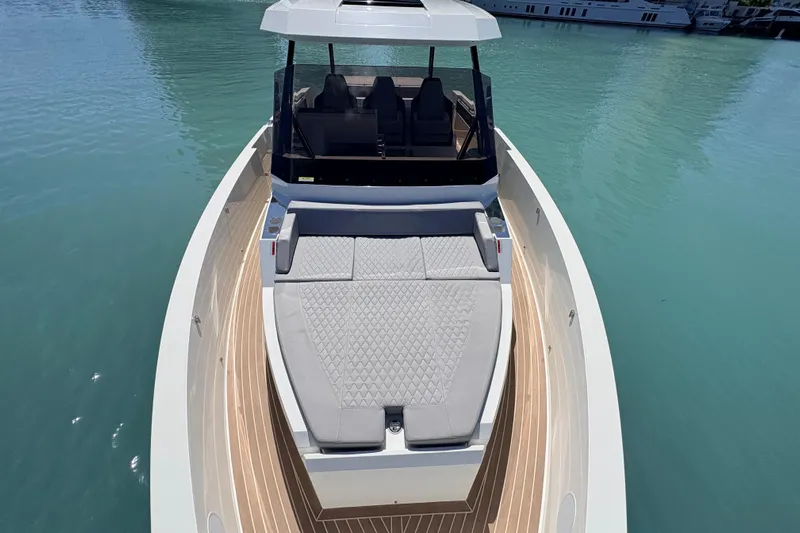 Casa - Ashanty Yacht Photos Pics 2025 De Antonio Yachts D32 luxury boat with sleek design on calm water.