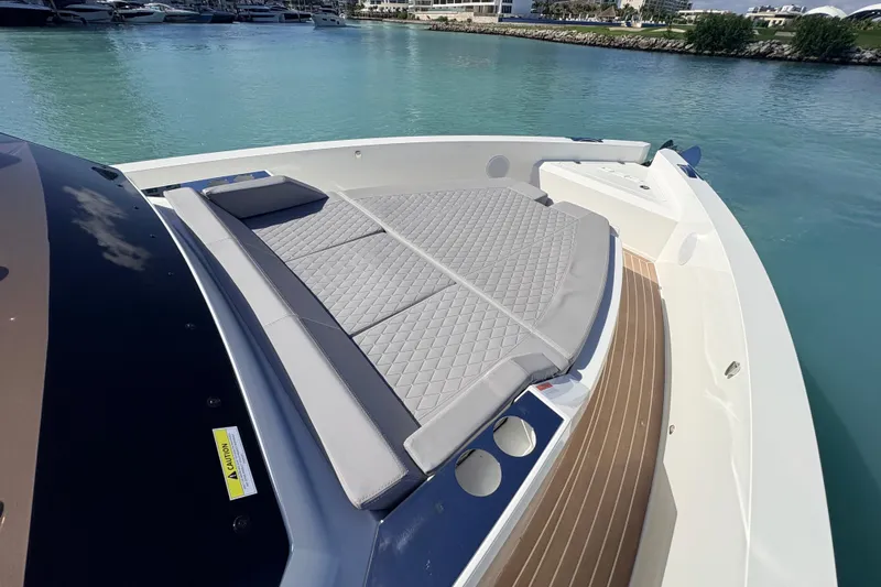 Casa - Ashanty Yacht Photos Pics 2025 De Antonio Yachts D32 with luxurious sunbed, docked in serene marina waters.