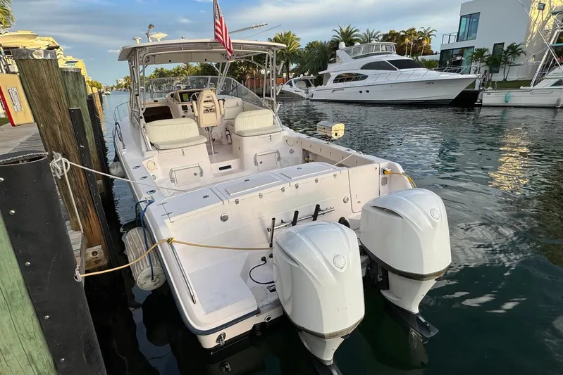  Yacht Photos Pics 2003 Grady-White Express 330 boat docked with twin outboard engines.