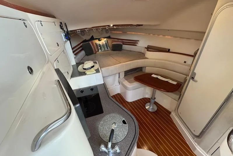  Yacht Photos Pics Luxurious interior of 2003 Grady-White Express 330 boat with cozy seating and kitchenette.