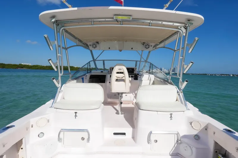  Yacht Photos Pics 2003 Grady-White Express 330 boat interior with seating, ocean view, and clear blue sky.