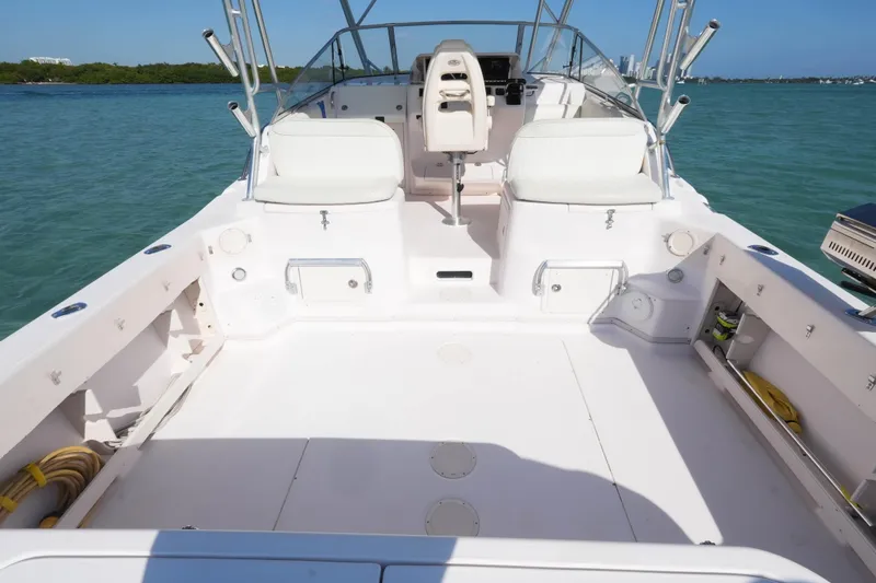  Yacht Photos Pics 2003 Grady-White Express 330 boat deck with seating, on calm water.