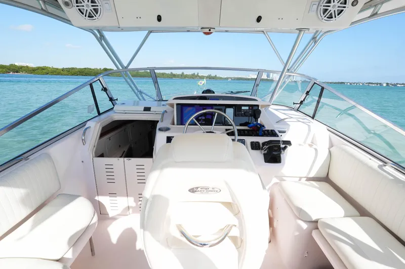  Yacht Photos Pics 2003 Grady-White Express 330 boat interior with helm, seating, and ocean view.