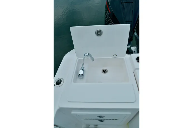  Yacht Photos Pics 2024 Fountain 32 NX Sportfish boat sink with faucet, featuring a sleek design.