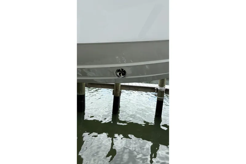  Yacht Photos Pics 2024 Fountain 32 NX Sportfish boat hull above water at dock.