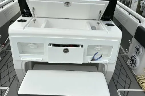  Yacht Photos Pics 2024 Fountain 32 NX Sportfish boat interior with storage compartments and seating.