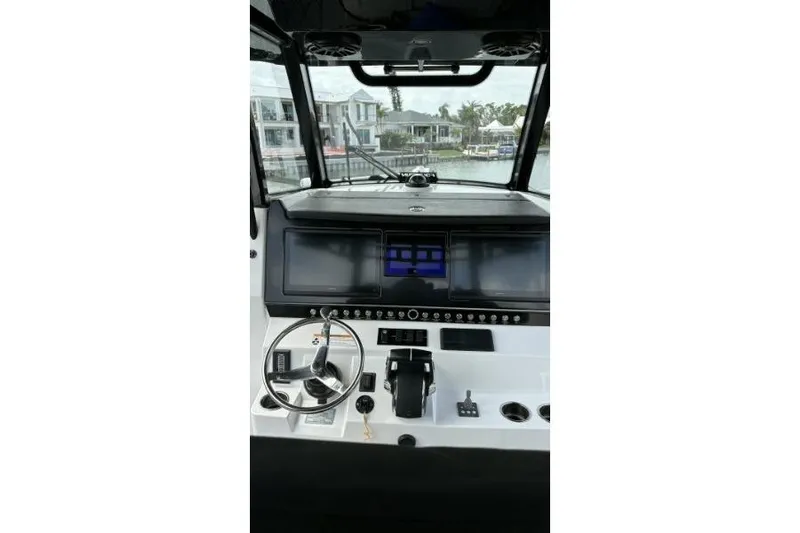  Yacht Photos Pics 2024 Fountain 32 NX Sportfish helm with modern controls and navigation screens.