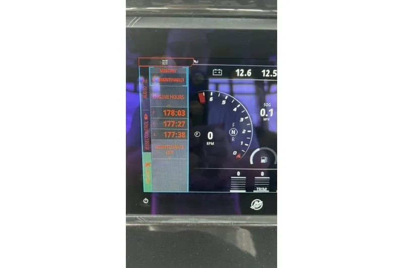  Yacht Photos Pics Dashboard display of 2024 Fountain 32 NX Sportfish showing engine hours and RPM gauge.