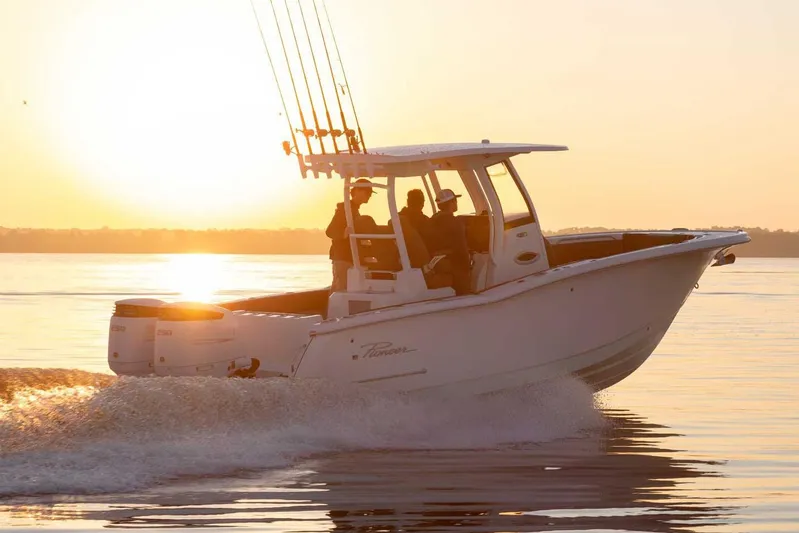  Yacht Photos Pics Manufacturer Provided Image: 2025 Pioneer 270 Pelagic boat cruising at sunset on calm waters.