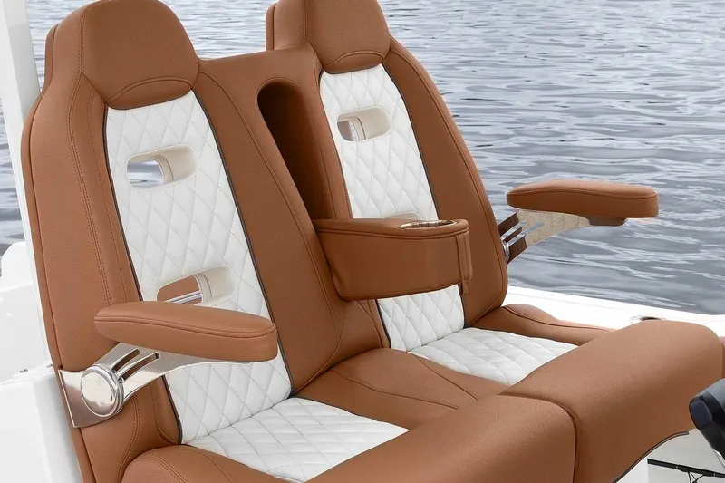  Yacht Photos Pics Manufacturer Provided Image: Luxury seating on 2025 Pioneer 270 Pelagic boat, featuring brown and white upholstery.