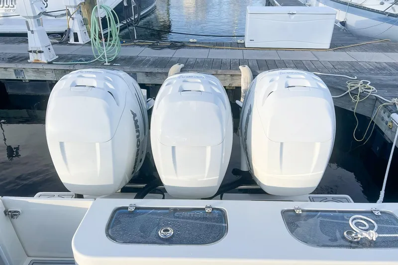 Tuna Toy Yacht Photos Pics Triple Mercury outboard engines on a 2002 Contender 36 Open boat at dock.
