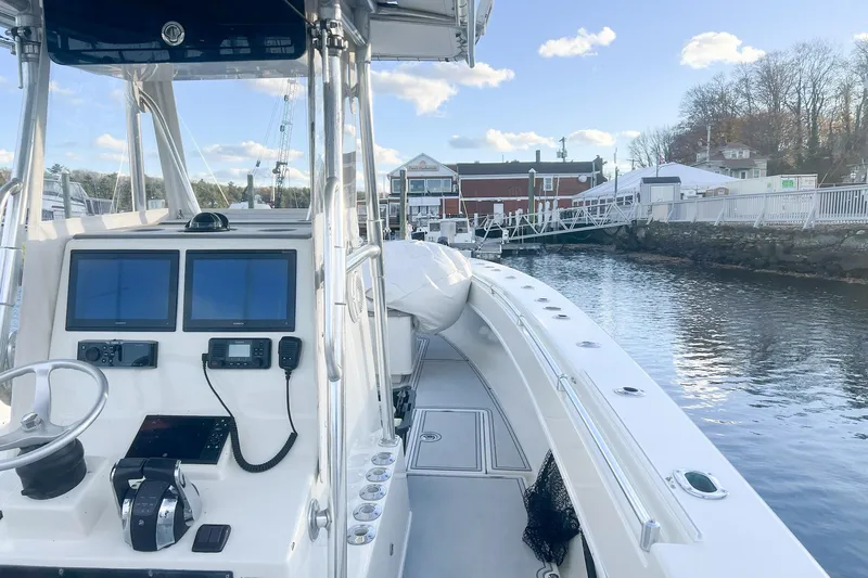 Tuna Toy Yacht Photos Pics 2002 Contender 36 Open boat with dual screens, docked by a scenic waterfront.
