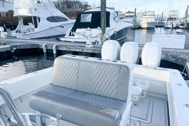 Tuna Toy Yacht Photos Pics 2002 Contender 36 Open boat at marina with luxury seating and multiple outboard engines.