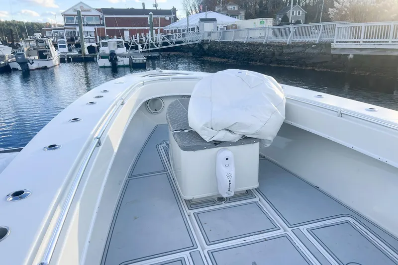 Tuna Toy Yacht Photos Pics 2002 Contender 36 Open boat docked at marina, featuring spacious deck and seating.