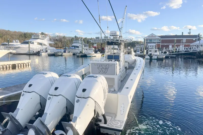 Tuna Toy Yacht Photos Pics 2002 Contender 36 Open boat docked with triple outboard engines.