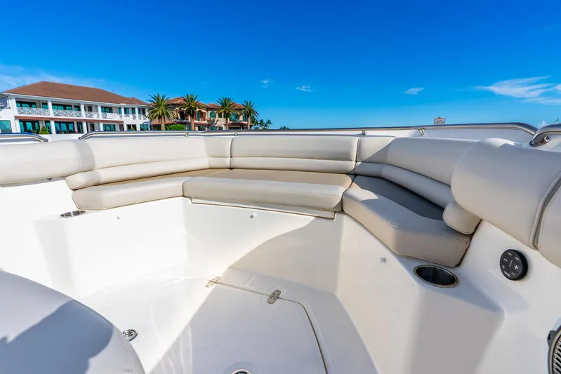Bwce0715h122 Yacht Photos Pics 2022 Boston Whaler 330 Outrage boat interior with luxurious seating and coastal view.