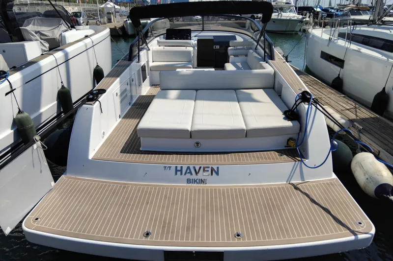  Yacht Photos Pics 2024 VanDutch 40 yacht docked, featuring spacious deck and luxurious seating.