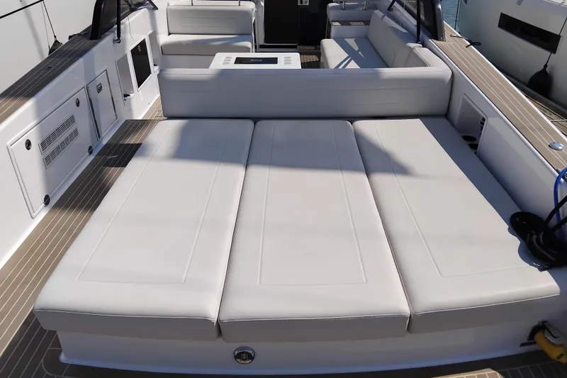  Yacht Photos Pics 2024 VanDutch 40 yacht interior with luxurious white seating and modern design.