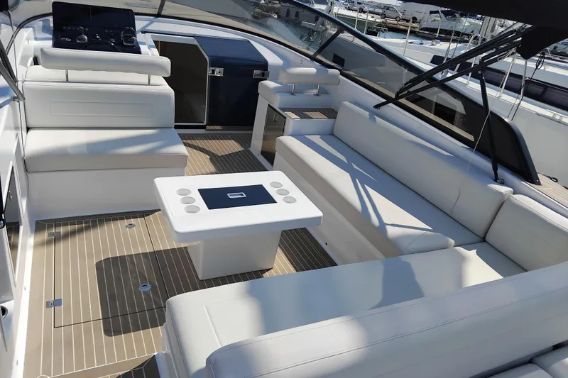  Yacht Photos Pics Luxurious 2024 VanDutch 40 yacht interior with sleek white seating and modern design.