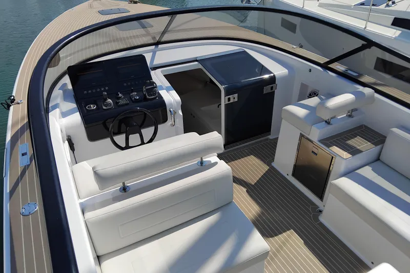  Yacht Photos Pics Luxurious 2024 VanDutch 40 yacht interior with sleek helm and modern seating.