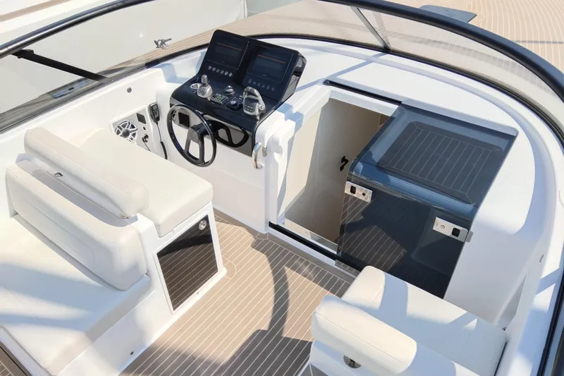  Yacht Photos Pics 2024 VanDutch 40 yacht cockpit with modern controls and sleek seating design.