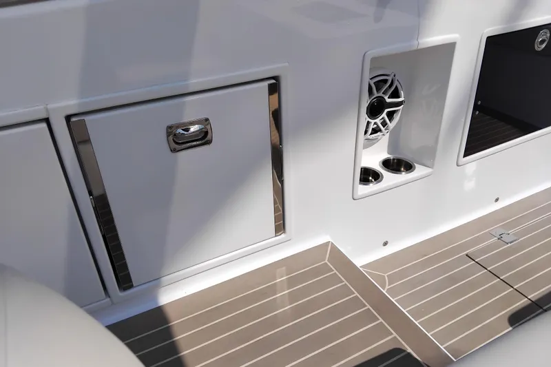  Yacht Photos Pics 2024 VanDutch 40 yacht interior with sleek cabinetry, speaker, and cup holders.