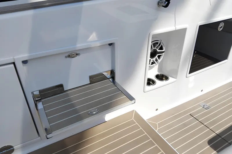  Yacht Photos Pics 2024 VanDutch 40 yacht interior with sleek design, featuring a speaker and cup holders.