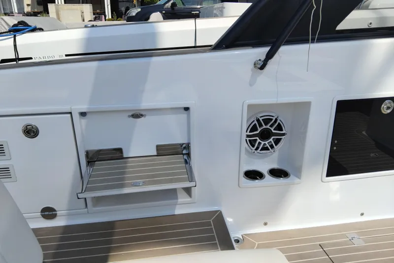  Yacht Photos Pics 2024 VanDutch 40 yacht interior with speaker, cup holders, and fold-out step.