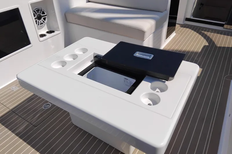  Yacht Photos Pics 2024 VanDutch 40 yacht interior with sleek seating and built-in cup holders.
