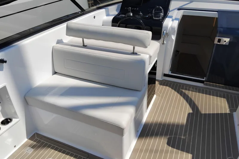  Yacht Photos Pics 2024 VanDutch 40 yacht interior with white seating and modern helm.