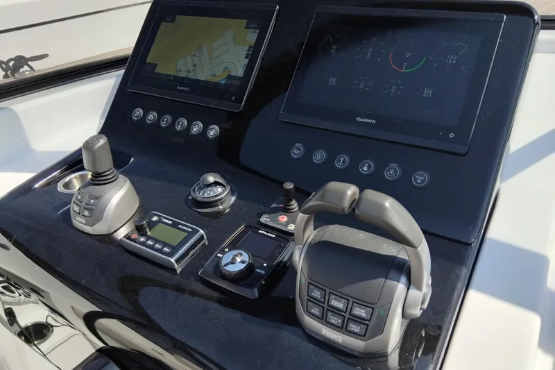  Yacht Photos Pics Control panel of 2024 VanDutch 40 yacht with navigation and throttle systems.