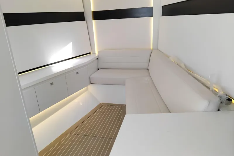  Yacht Photos Pics Luxurious interior of 2024 VanDutch 40 yacht with sleek white seating and modern design.