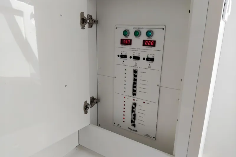  Yacht Photos Pics Electrical panel inside 2024 VanDutch 40 yacht, featuring digital displays and circuit breakers.