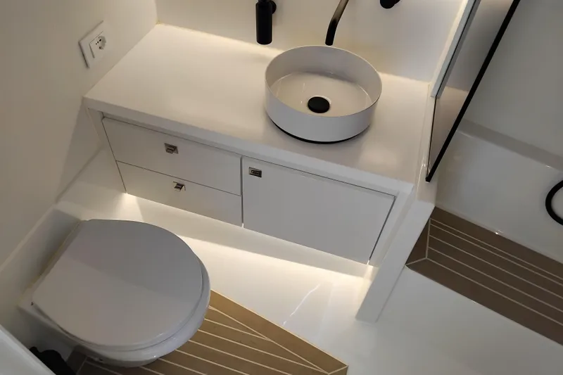  Yacht Photos Pics Luxurious bathroom interior of 2024 VanDutch 40 yacht with modern fixtures and sleek design.