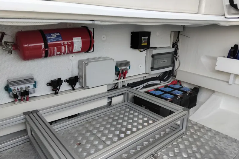  Yacht Photos Pics Electrical compartment of 2024 VanDutch 40 yacht with fire extinguisher and battery setup.