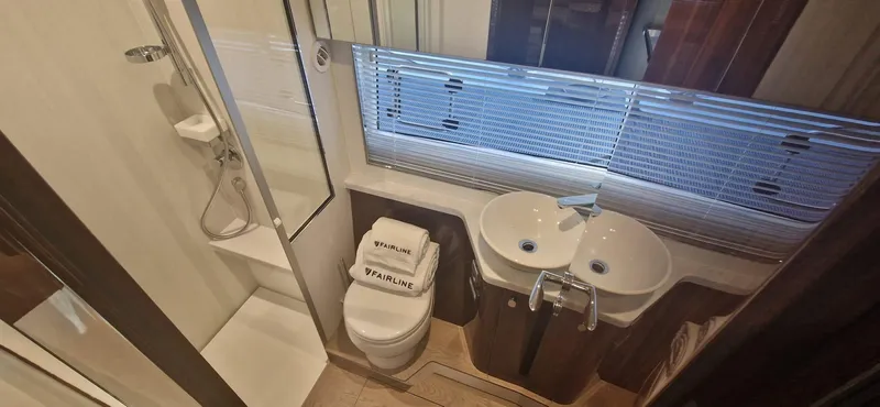 In Stock Yacht Photos Pics Luxurious bathroom in 2025 Fairline Targa 45 Open yacht with dual sinks and shower.