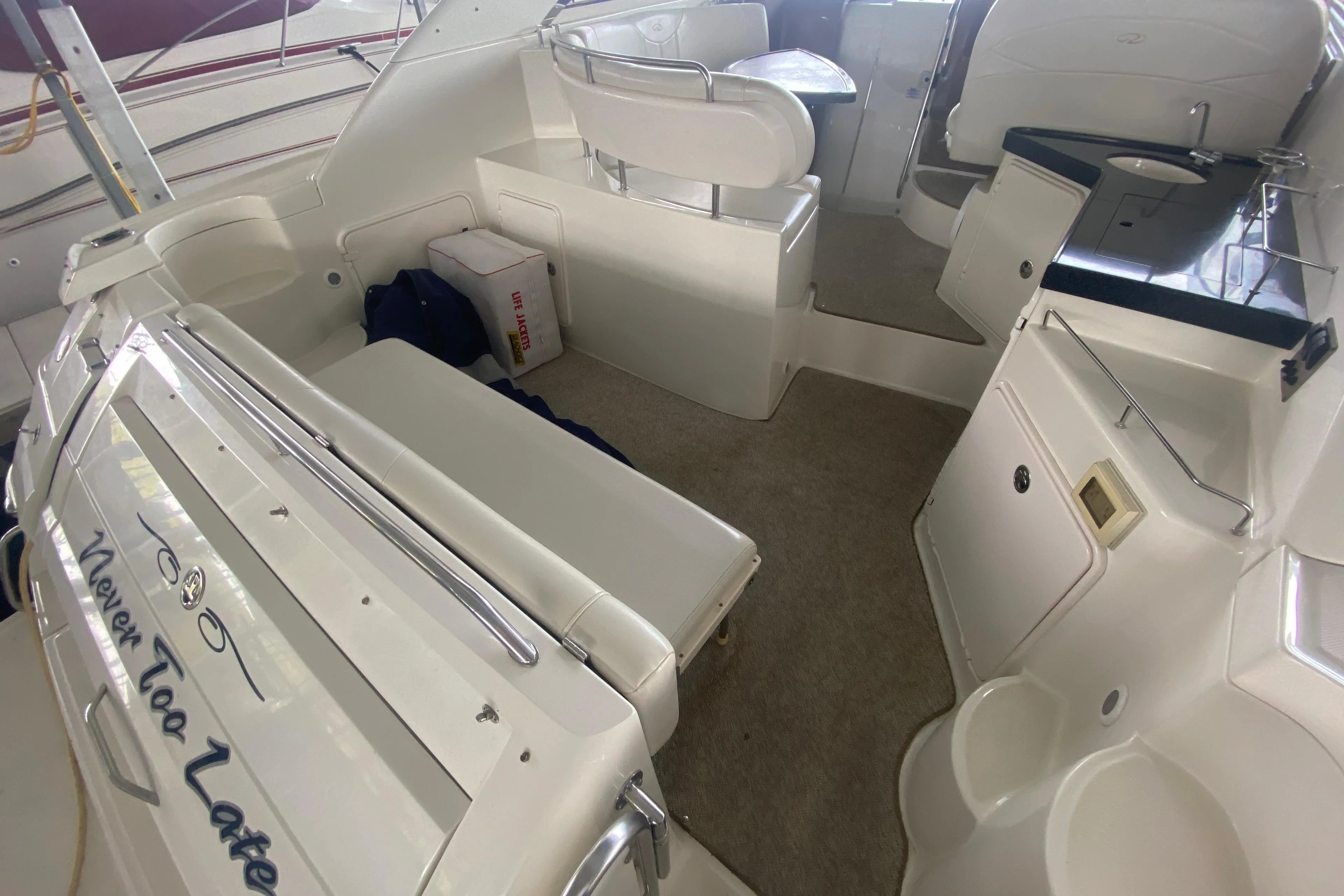 2004 Regal Commodore 3560 boat interior with seating and storage areas.