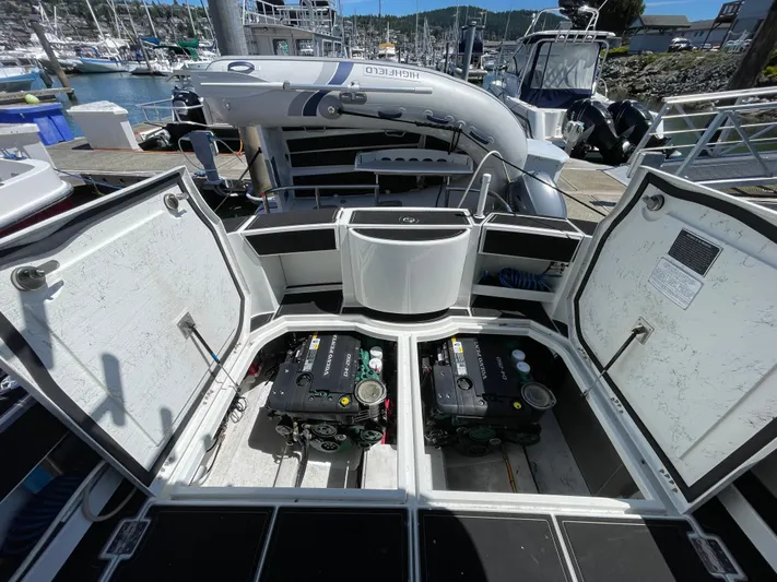 Ocean Roamer Yacht Photos Pics Open engine compartment of 2016 Lindell Ocean Roamer boat at marina dock.