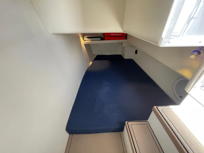 Ocean Roamer Yacht Photos Pics 2016 Lindell Ocean Roamer interior cabin with blue carpet and life jackets storage.