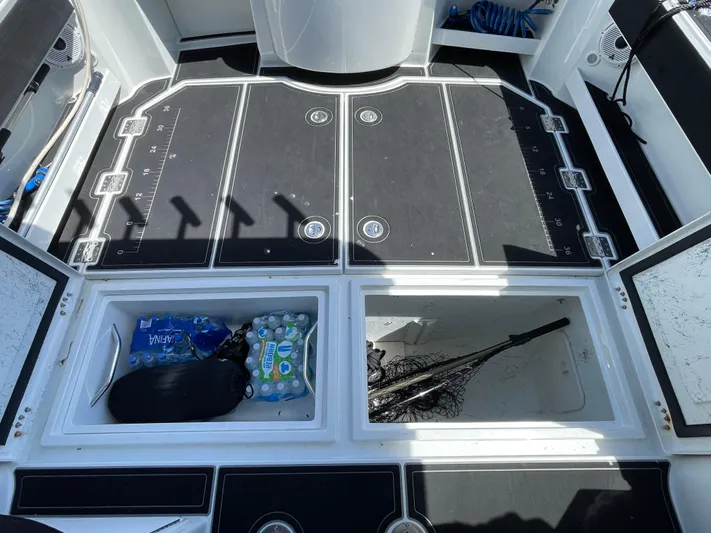 Ocean Roamer Yacht Photos Pics 2016 Lindell Ocean Roamer deck with storage compartments, fishing gear, and bottled water.