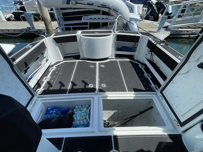 Ocean Roamer Yacht Photos Pics 2016 Lindell Ocean Roamer boat deck with storage compartments and fishing gear.