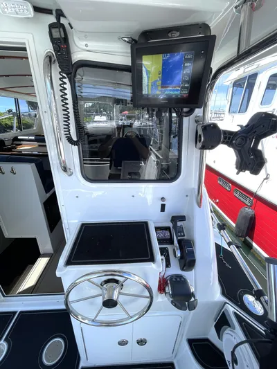 Ocean Roamer Yacht Photos Pics Control panel of a 2016 Lindell Ocean Roamer boat with navigation equipment.