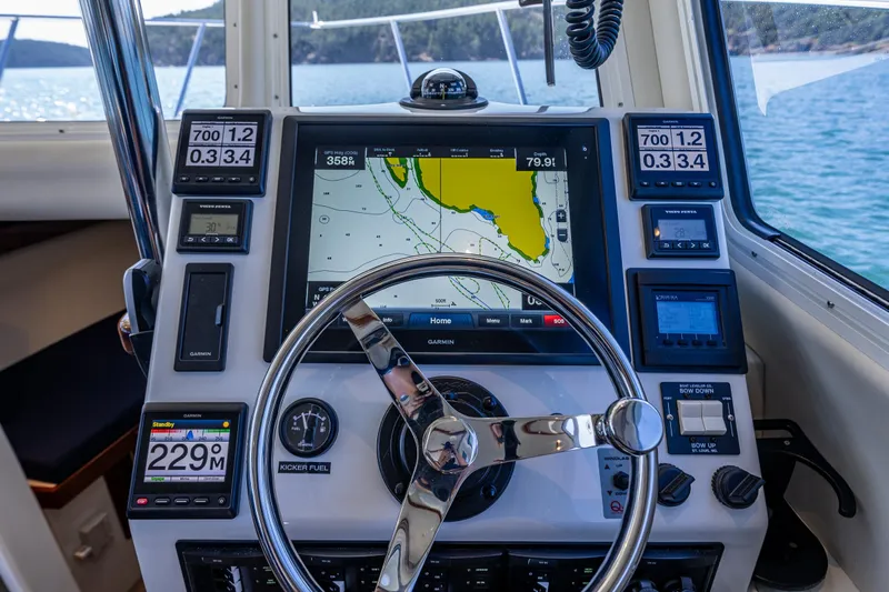 Ocean Roamer Yacht Photos Pics Cockpit of 2016 Lindell Ocean Roamer with navigation system and steering wheel.