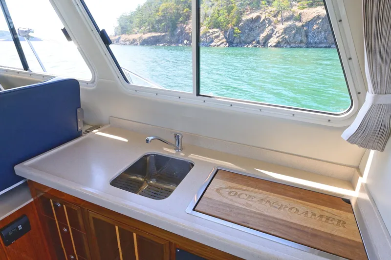 Ocean Roamer Yacht Photos Pics Interior of 2016 Lindell Ocean Roamer yacht with sink and scenic ocean view.