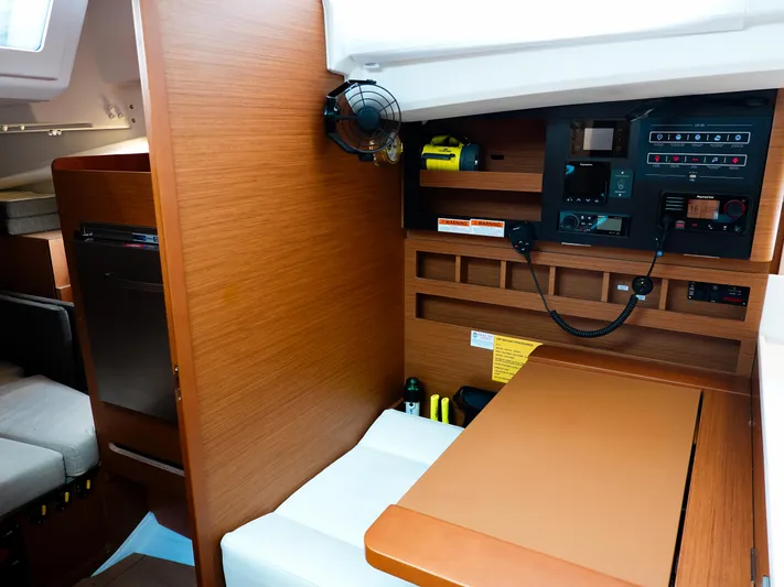 Rhythm & Blues Yacht Photos Pics 2024 Jeanneau Sun Odyssey 440 interior with navigation station and wooden cabinetry.