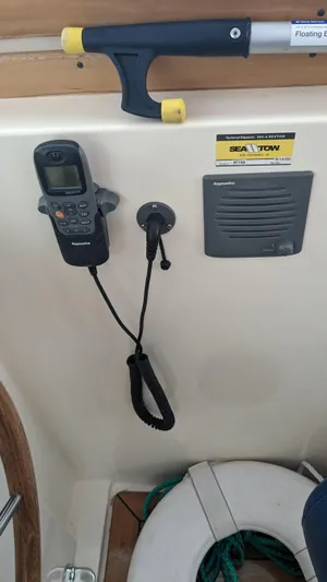 Sea Ranger Yacht Photos Pics 2008 Sabre 34 Express boat cockpit with marine radio and safety equipment.