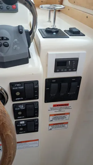 Sea Ranger Yacht Photos Pics Control panel of a 2008 Sabre 34 Express boat with various switches and gauges.