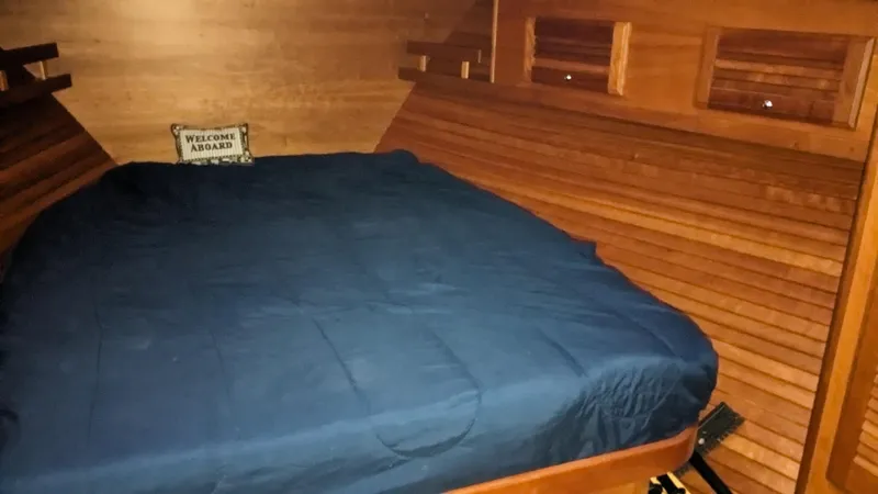 Sea Ranger Yacht Photos Pics 2008 Sabre 34 Express cabin with cozy bed and wooden interior.