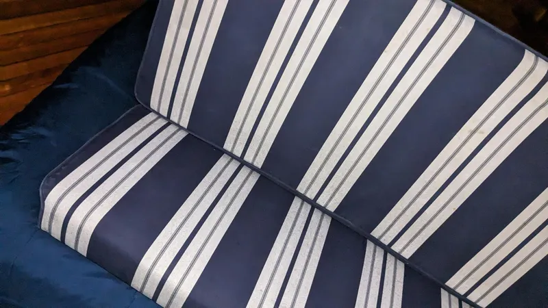 Sea Ranger Yacht Photos Pics Blue and white striped seat cushion on a 2008 Sabre 34 Express boat.